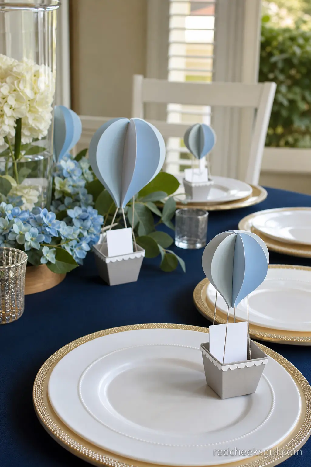 Dusty Blue Paper Balloon Place Settings — Small paper hot air balloons standing at each place setting double as place card holders, which saves buying a