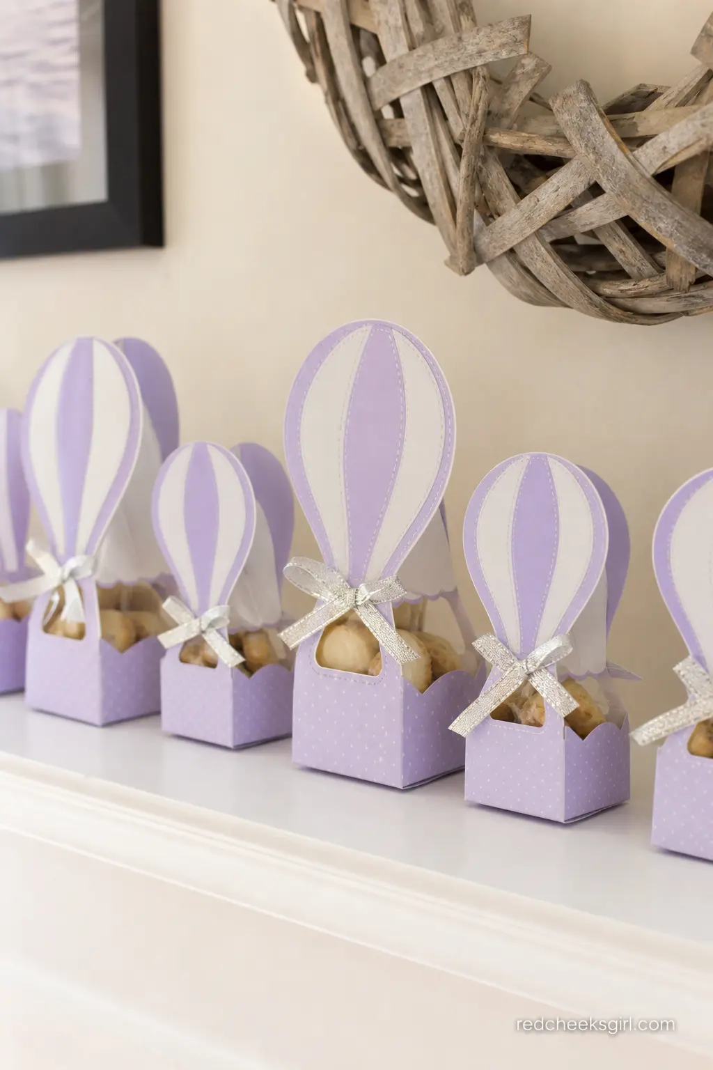 Lavender Balloon Cookie Favor Boxes — Small boxes shaped like hot air balloon baskets, in lavender and white with a silver ribbon tie, hold a cookie or two