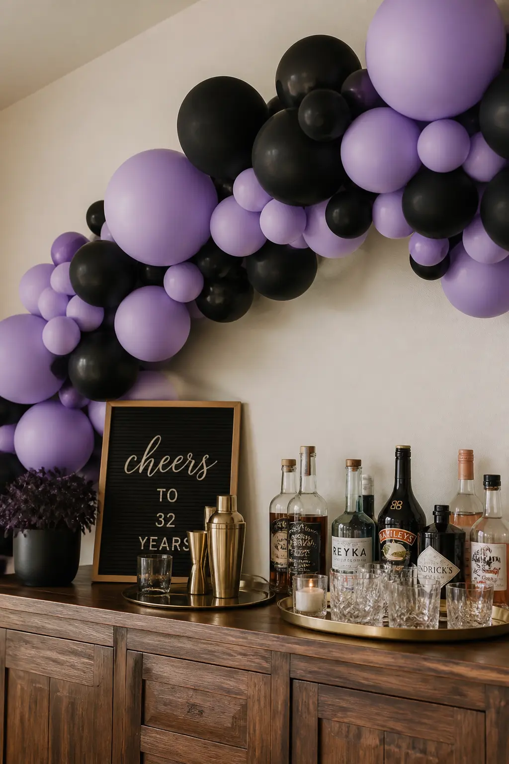 Lavender and Black Garland Behind a Bar for an Adult Birthday — Black is the most transformative second colour in this list. Lavender balloon arch