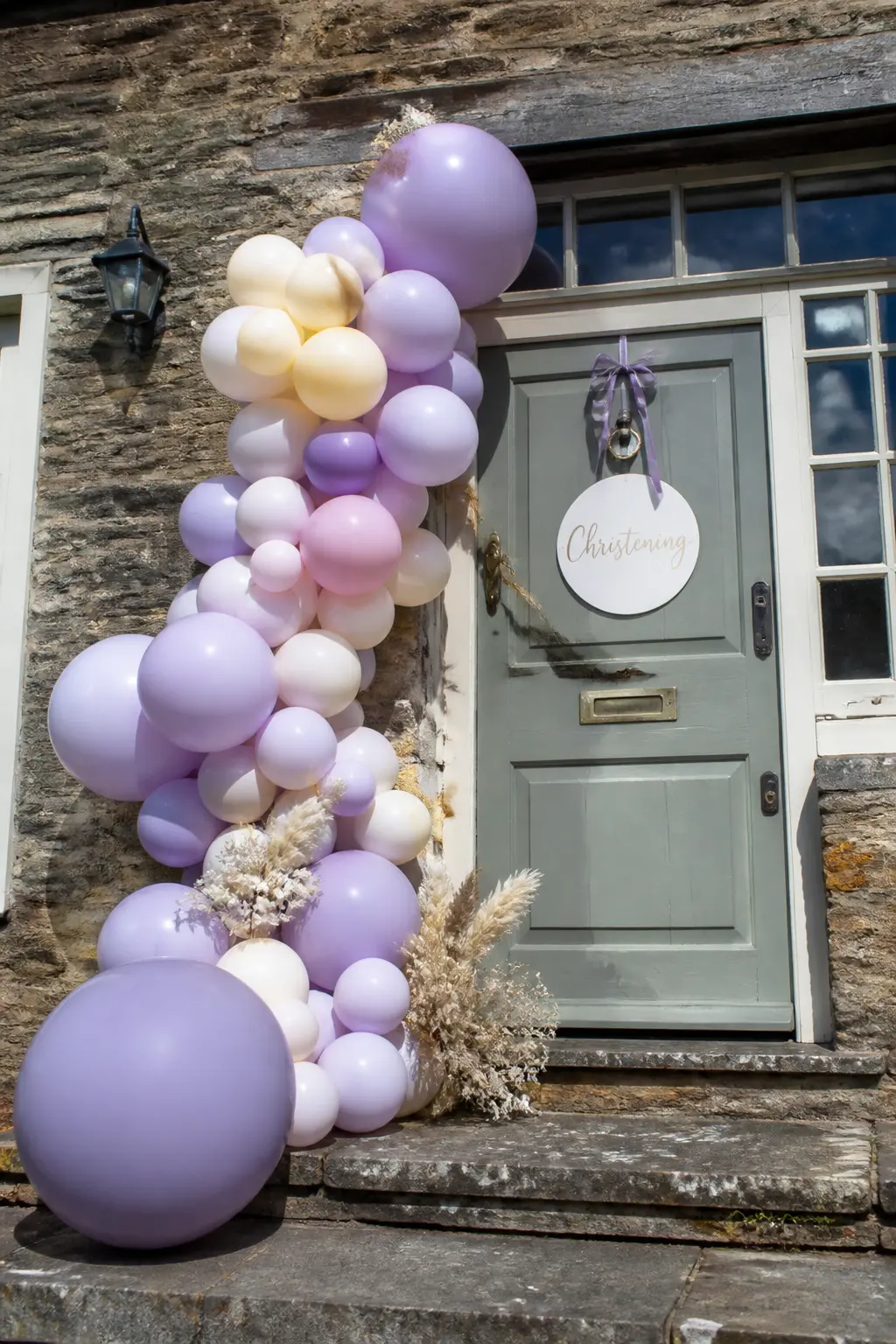 Lavender and Cream Cascade Beside a Front Door for a Christening — A cascade rather than a full arch suits a front door where there is no overhead fixing