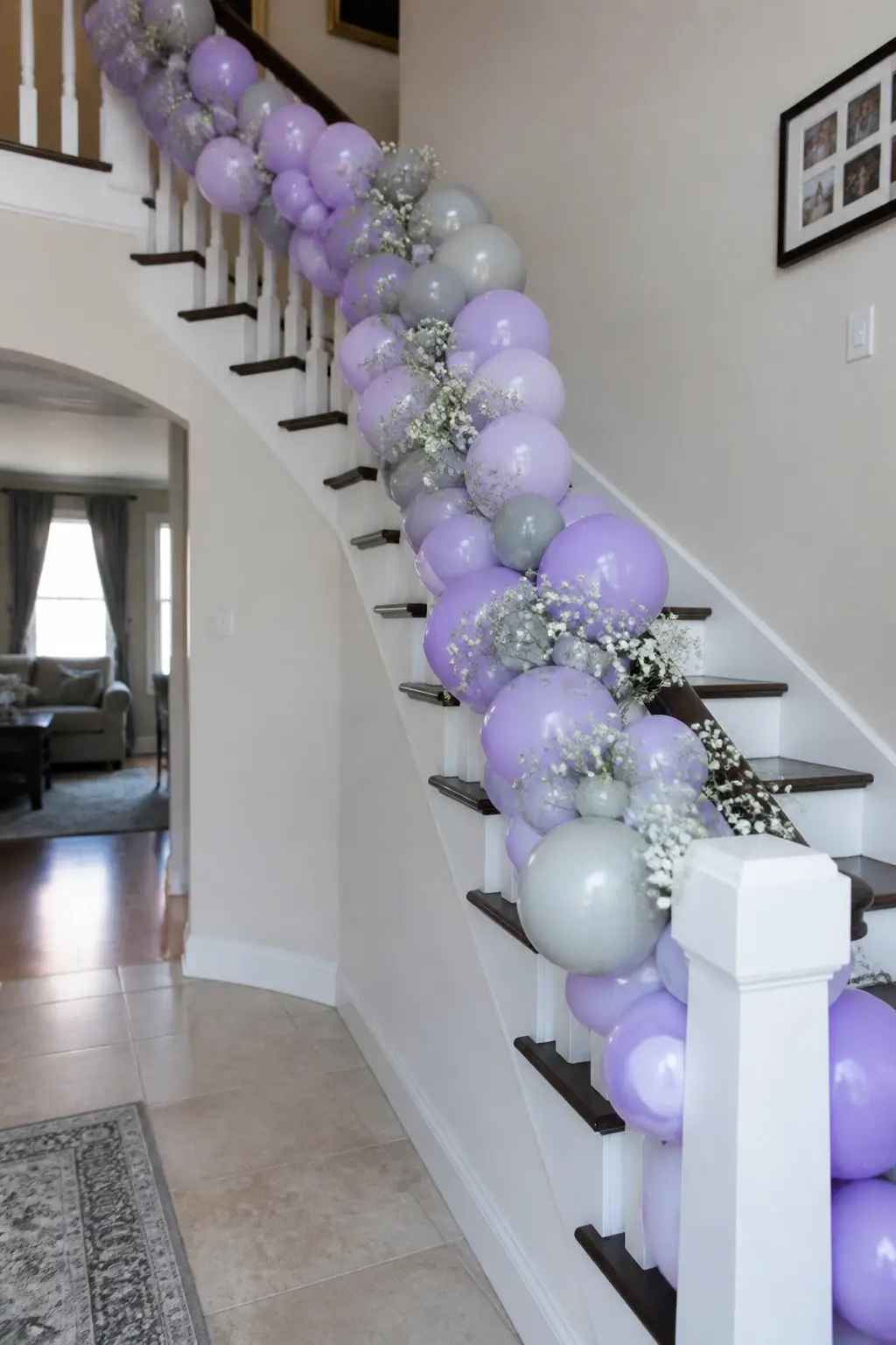 Lavender and Grey Garland Along a Stair Banister for a House Party — A banister garland works the architecture of the space rather than fighting it. Lavender