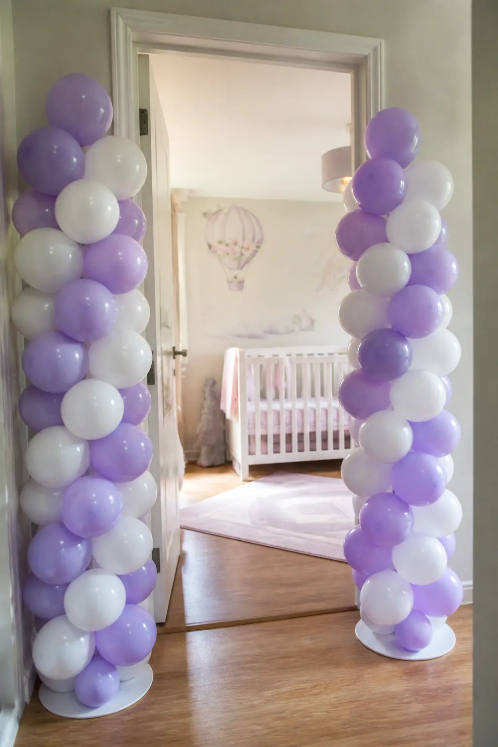 Lavender and White Columns Either Side of a Nursery Doorway — Two columns rather than a connected arch works when the doorway is too wide or too low for a