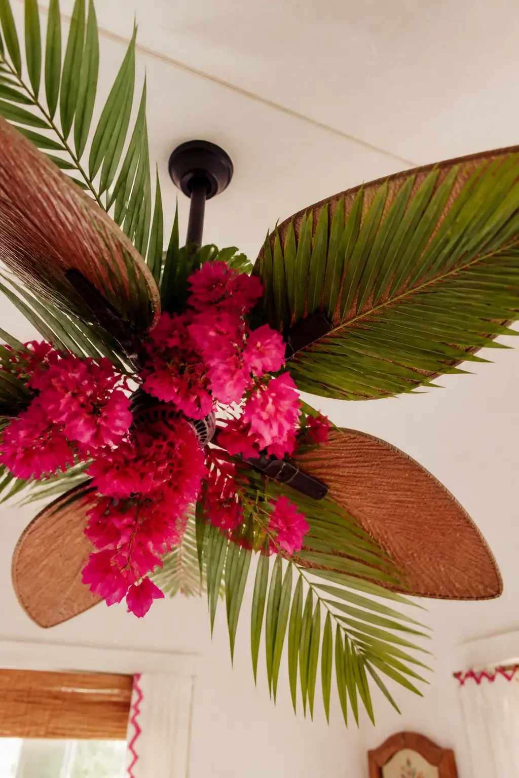 Palm Leaf Ceiling Fan Detail — Tuck three or four large real or faux palm leaves into the blades of an overhead ceiling fan, letting them droop slightly.