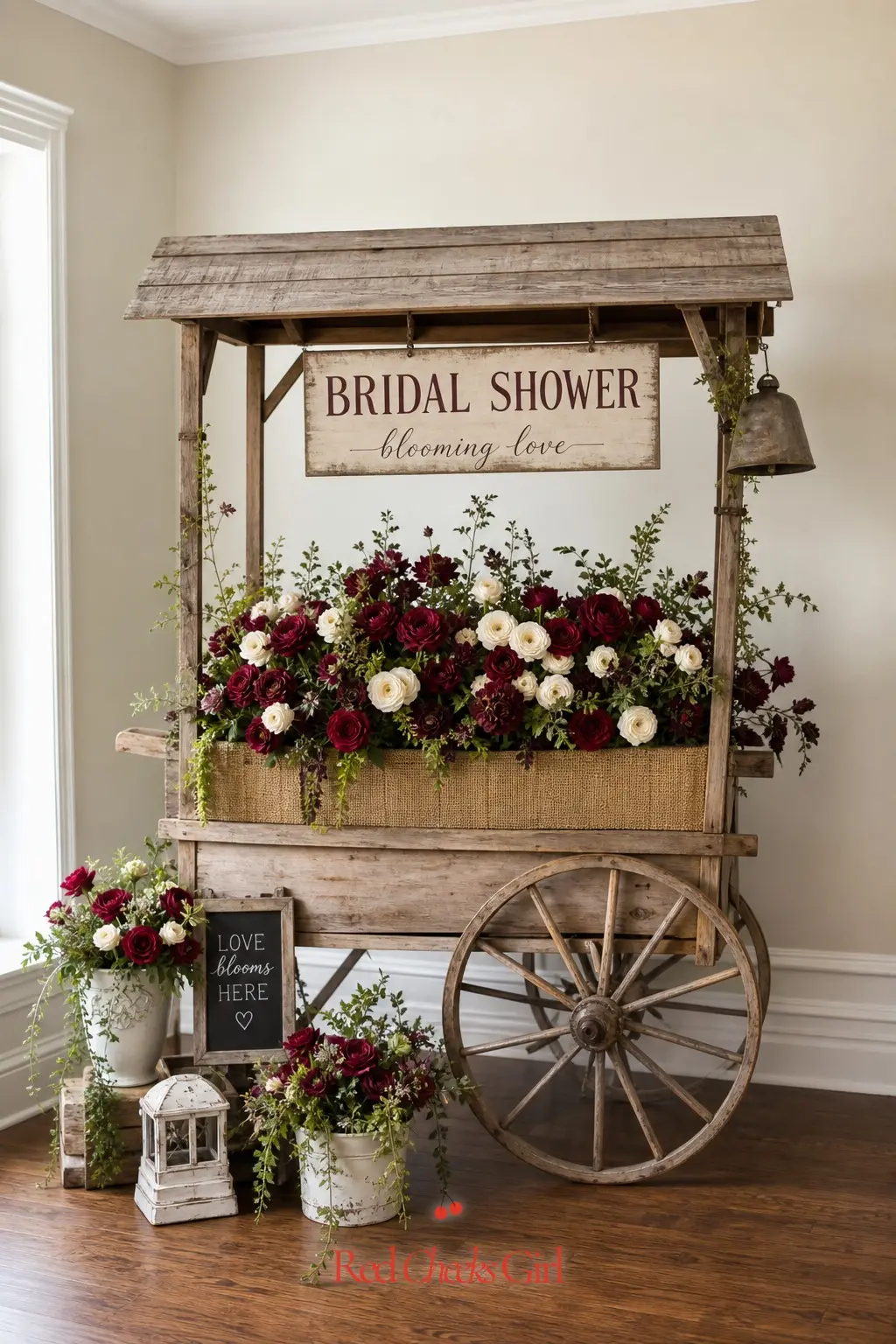 Vintage Flower Cart Photo Backdrop — A weathered wooden cart, the kind sold as garden decor, stacked with burgundy roses and cream ranunculus turns any bare