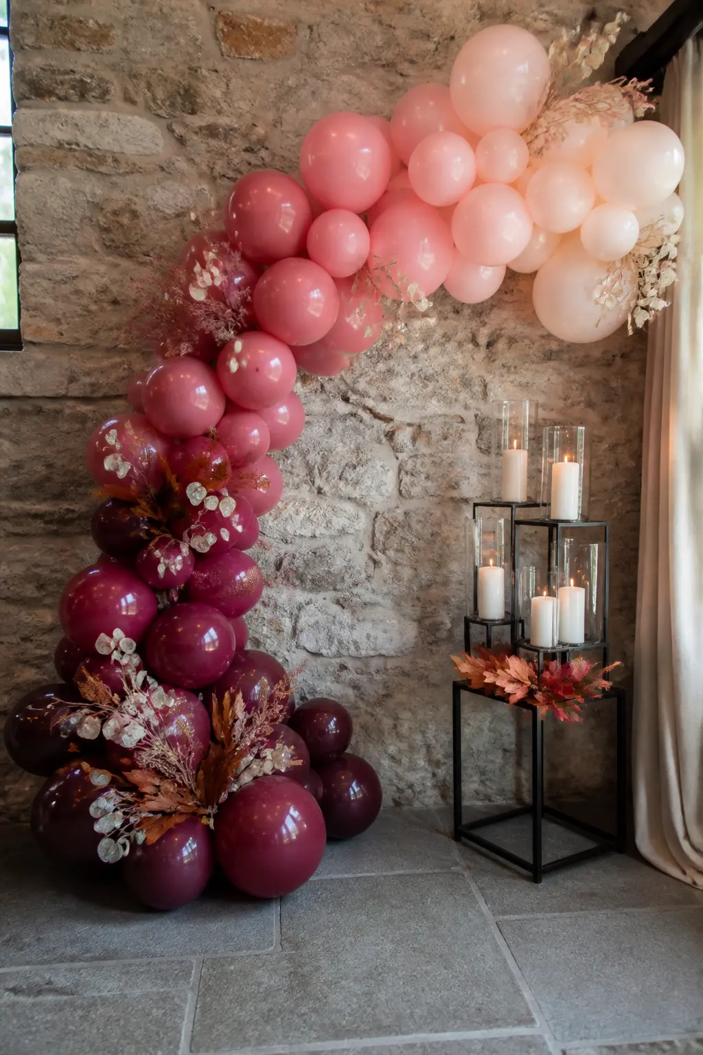 Burgundy to Blush at an Autumn Wedding Photo Corner — A photo corner is a backdrop that earns its space by being used: every guest stands in front of it at