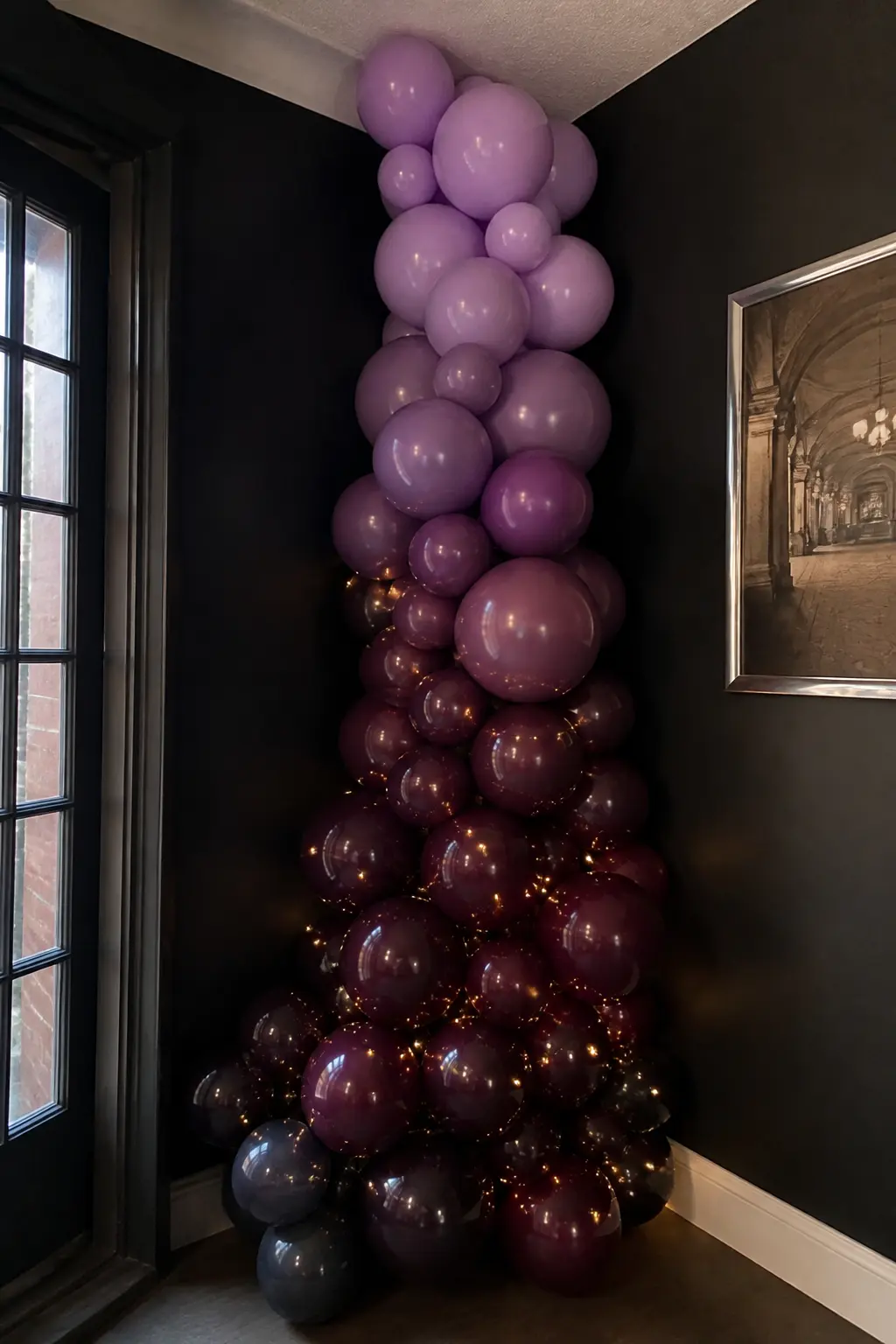 Lavender to Aubergine Cascade Down a Corner — An evening party calls for depth. Ombre balloon arch