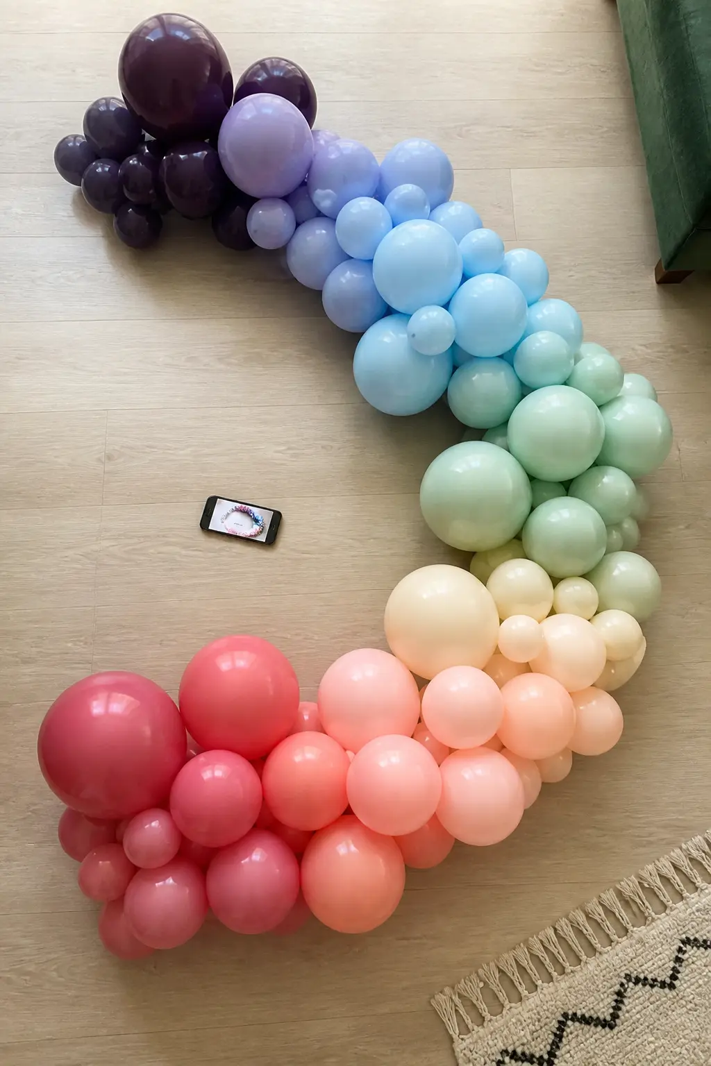 Method: Lay It on the Floor and Photograph It Before Mounting — Build the entire garland on the floor before a single balloon goes on a wall. Ombre balloon arch