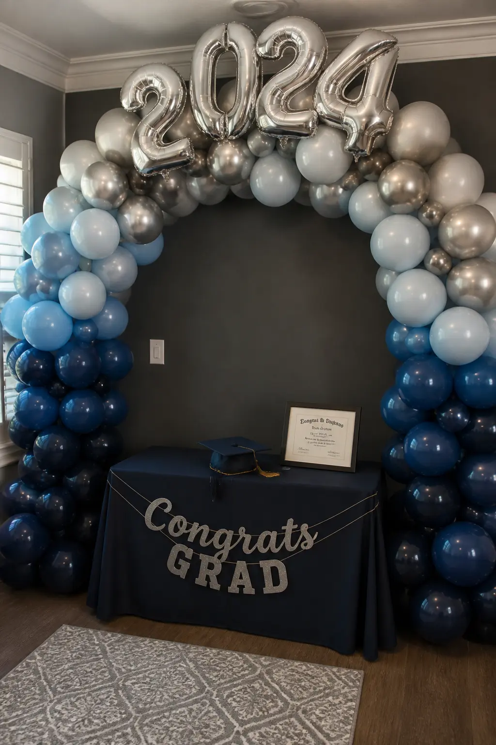 Navy to Silver at a Graduation with Number Balloons — A graduation arch needs to hold number balloons without the numbers looking bolted on. Ombre balloon arch