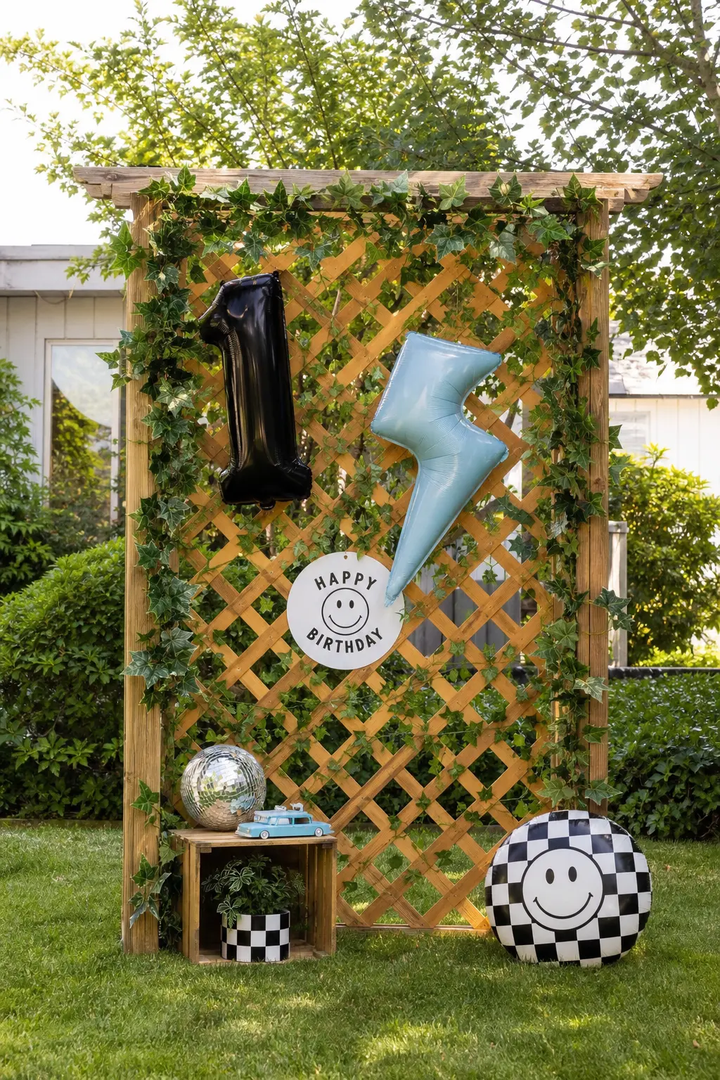 The Garden Lattice Backdrop — For a backyard party, a wooden lattice frame wrapped in real ivy gives you the height of a backdrop without a single indoor wall