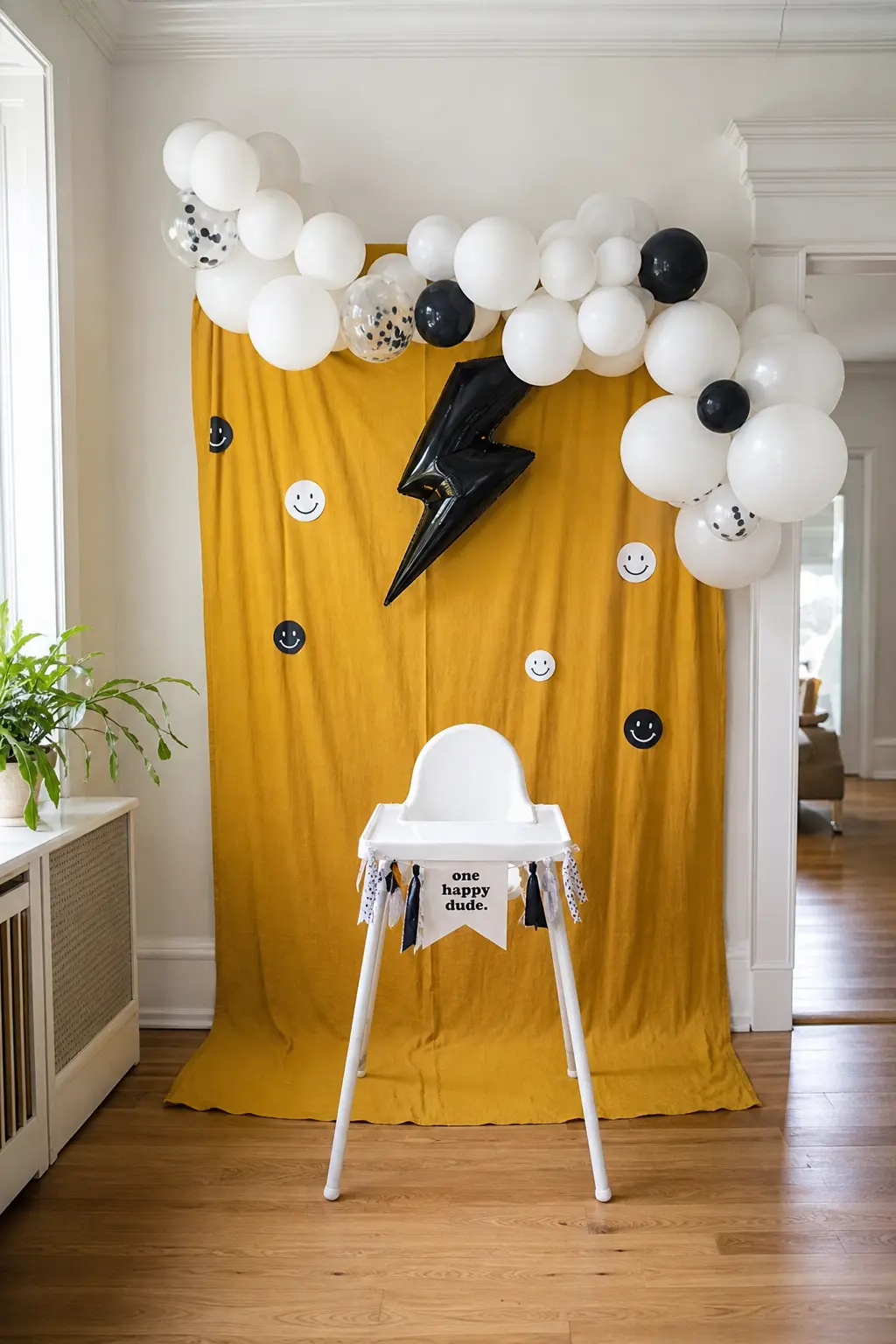 Mini Backdrop Behind the High Chair — If the full wall backdrop feels like too much for a corner nobody sees until the smash cake moment, a mustard fabric