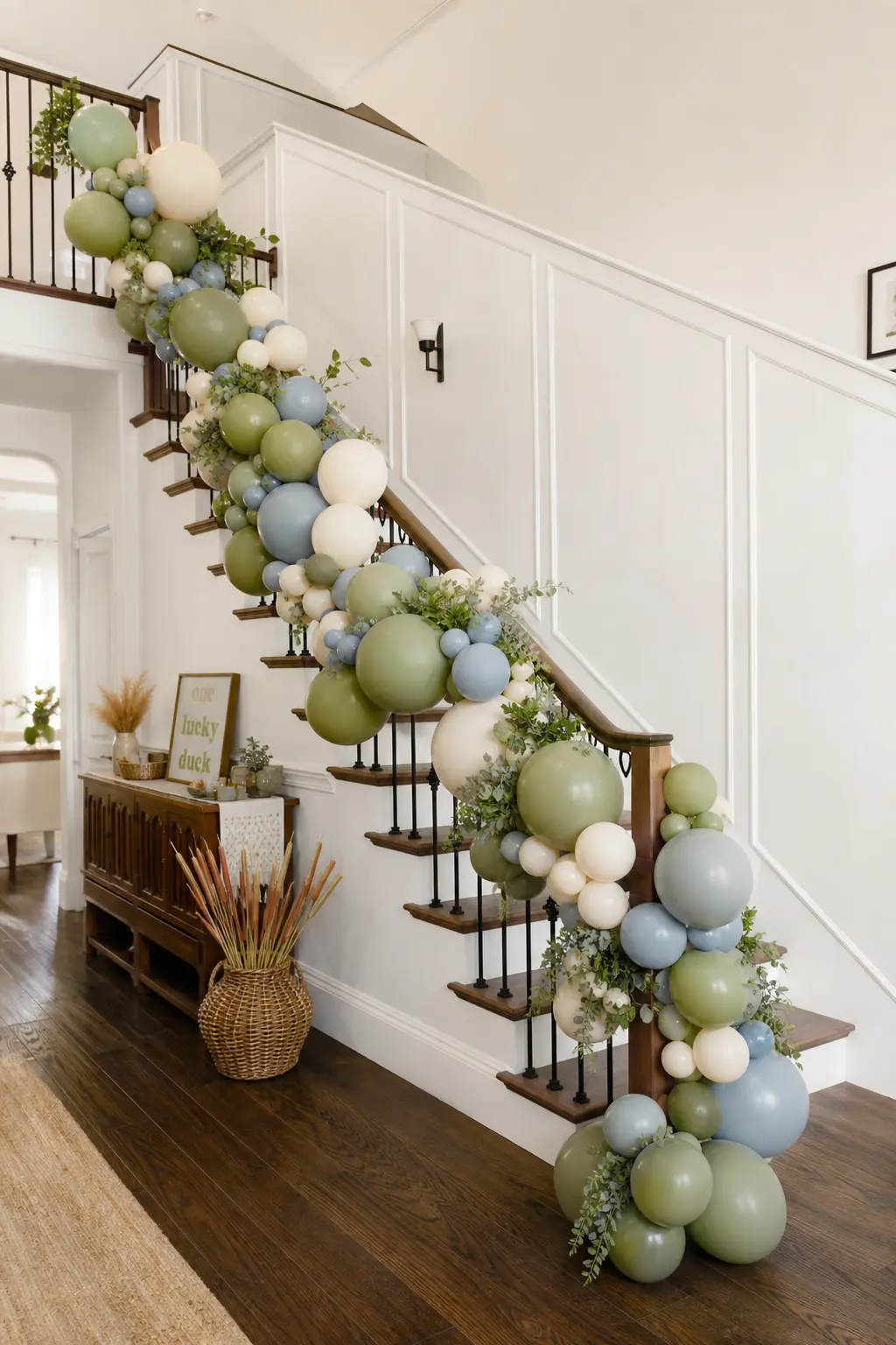 Staircase Balloon Garland — If the party has a staircase, it is free real estate for decor that nobody else at a first birthday is using. One lucky duck