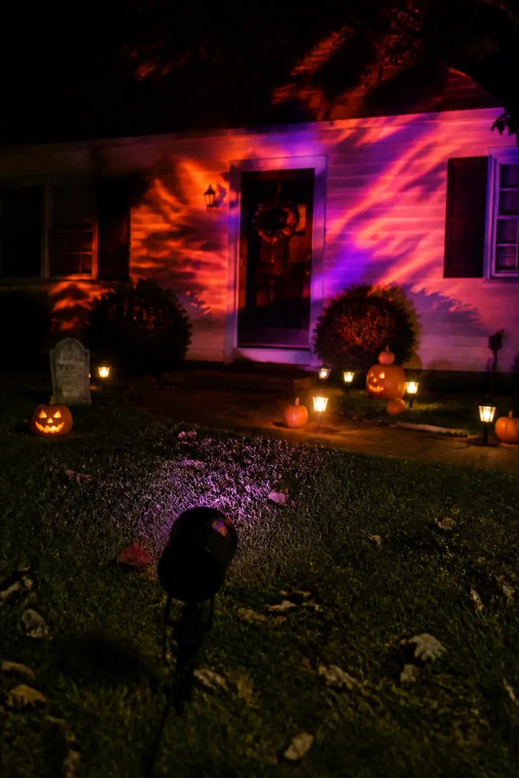Colour-Changing LED Projector Aimed at the House Wall