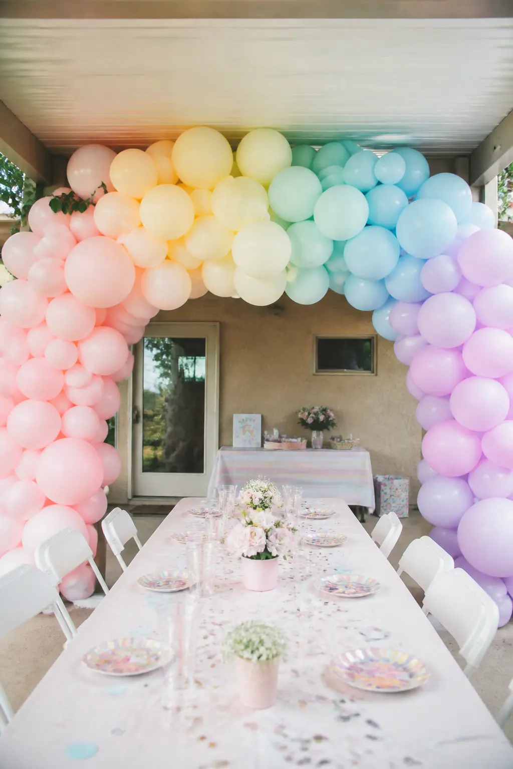 All Five Pastels in Spectrum Order Over a Children's Party Table — This is the one entry that uses more than three colours, and it earns the exception by