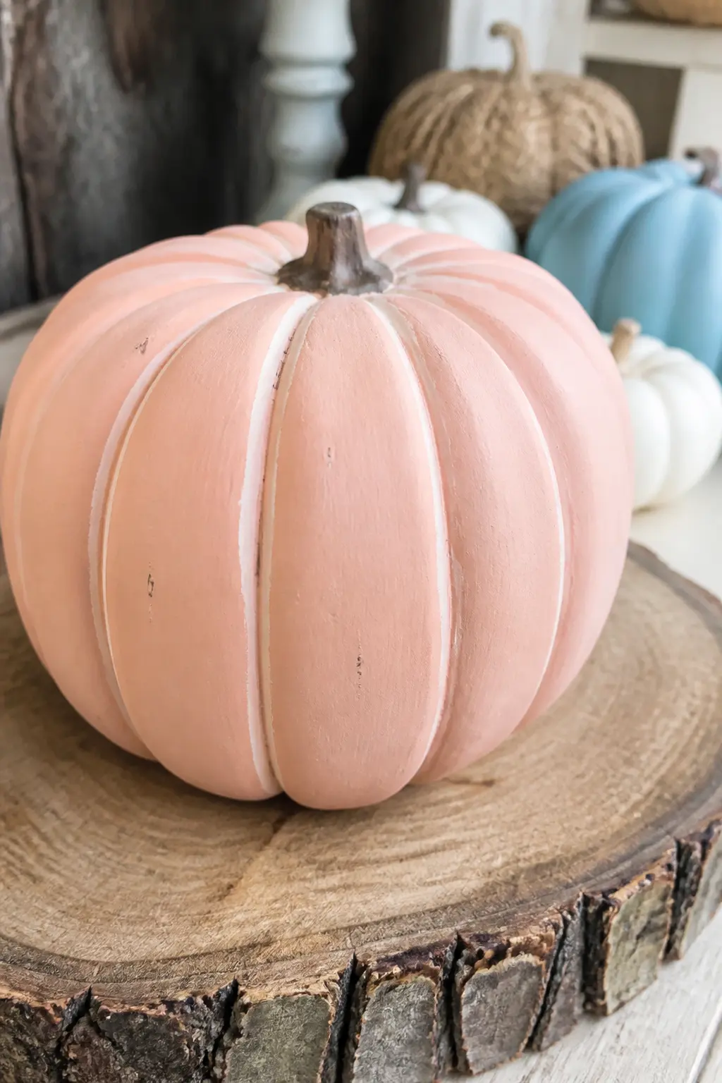 Chalk Paint Sanded at the Ridges — Apply chalk paint in any pastel shade and allow it to dry fully. Pastel painted pumpkin