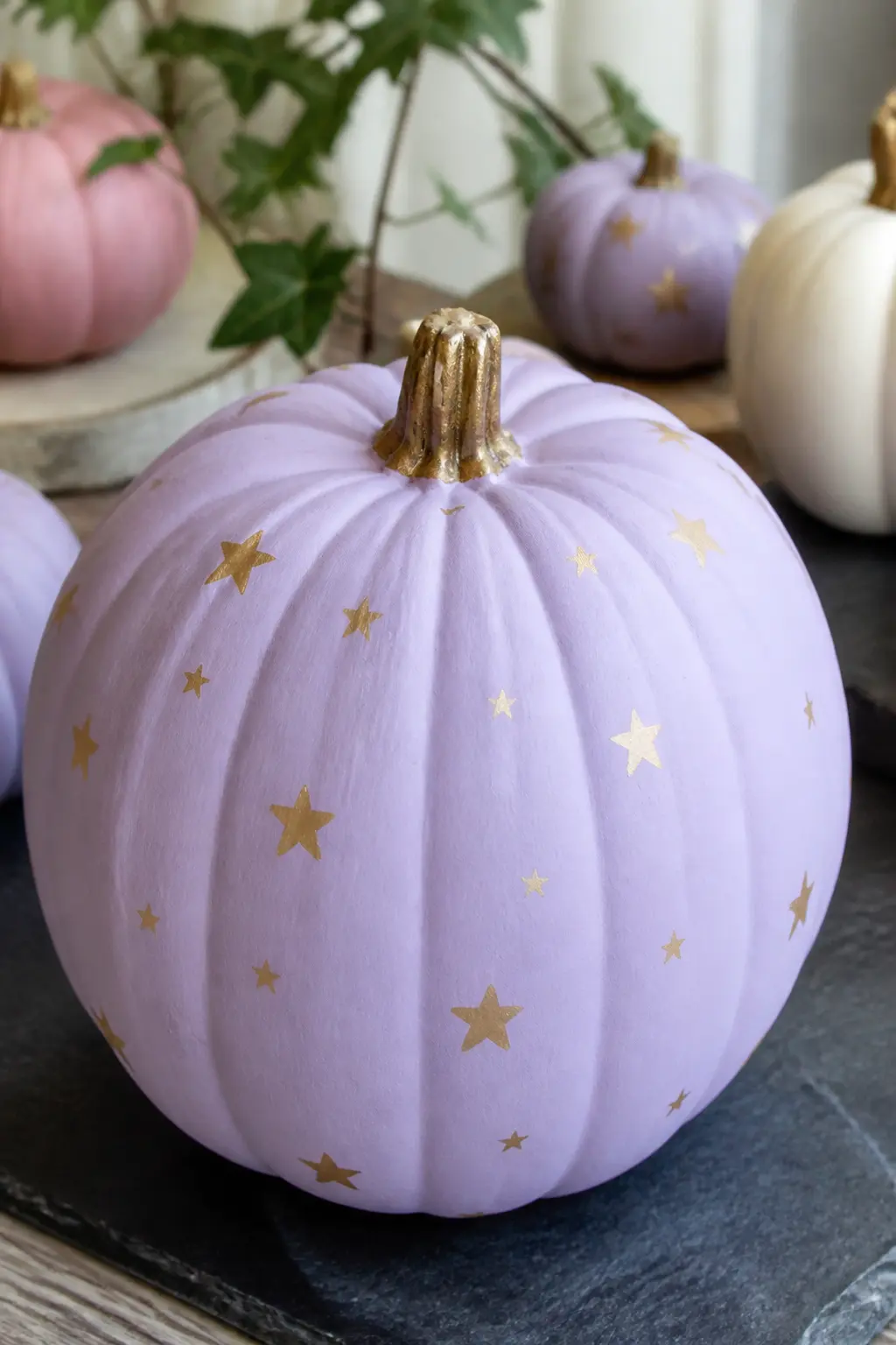 Lilac Pumpkin With Tiny Gold Stars — Paint the pumpkin in flat matte lilac. Pastel painted pumpkin