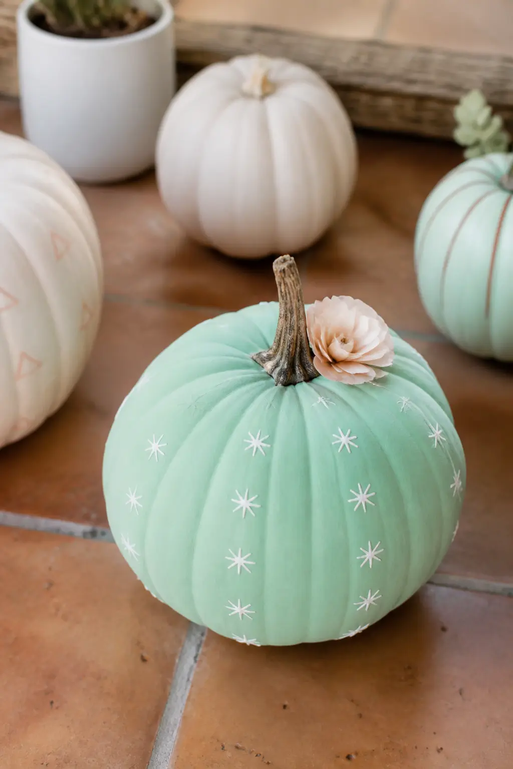 Mint Cactus Pumpkin With Paper Flower — Paint the whole pumpkin in flat matte mint and let it dry completely. Pastel painted pumpkin