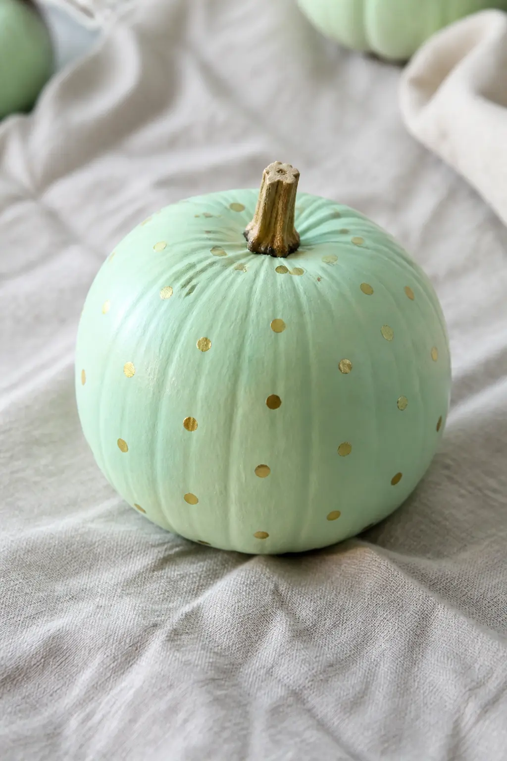 Mint Pumpkin With Gold Dots — This is the most restrained mint entry and, for that reason, the easiest to live with in a mixed display. Pastel painted pumpkin