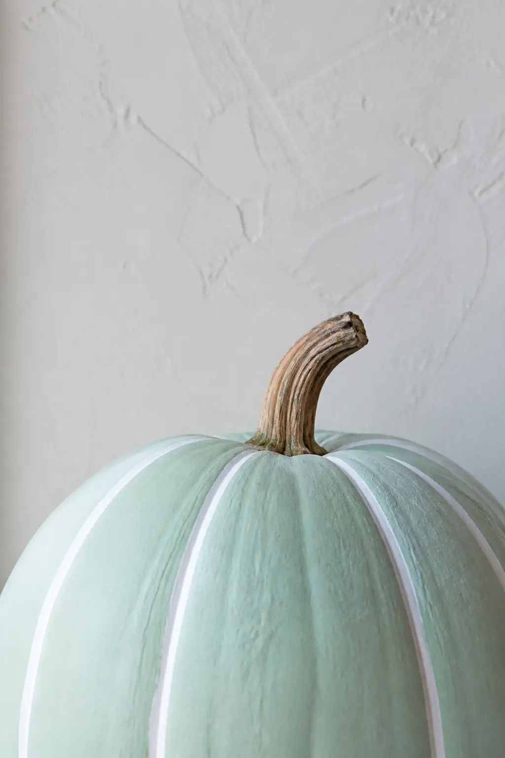 Mint Pumpkin With White Ridge Stripes — The ridges of a pumpkin are a built-in guide. Pastel painted pumpkin