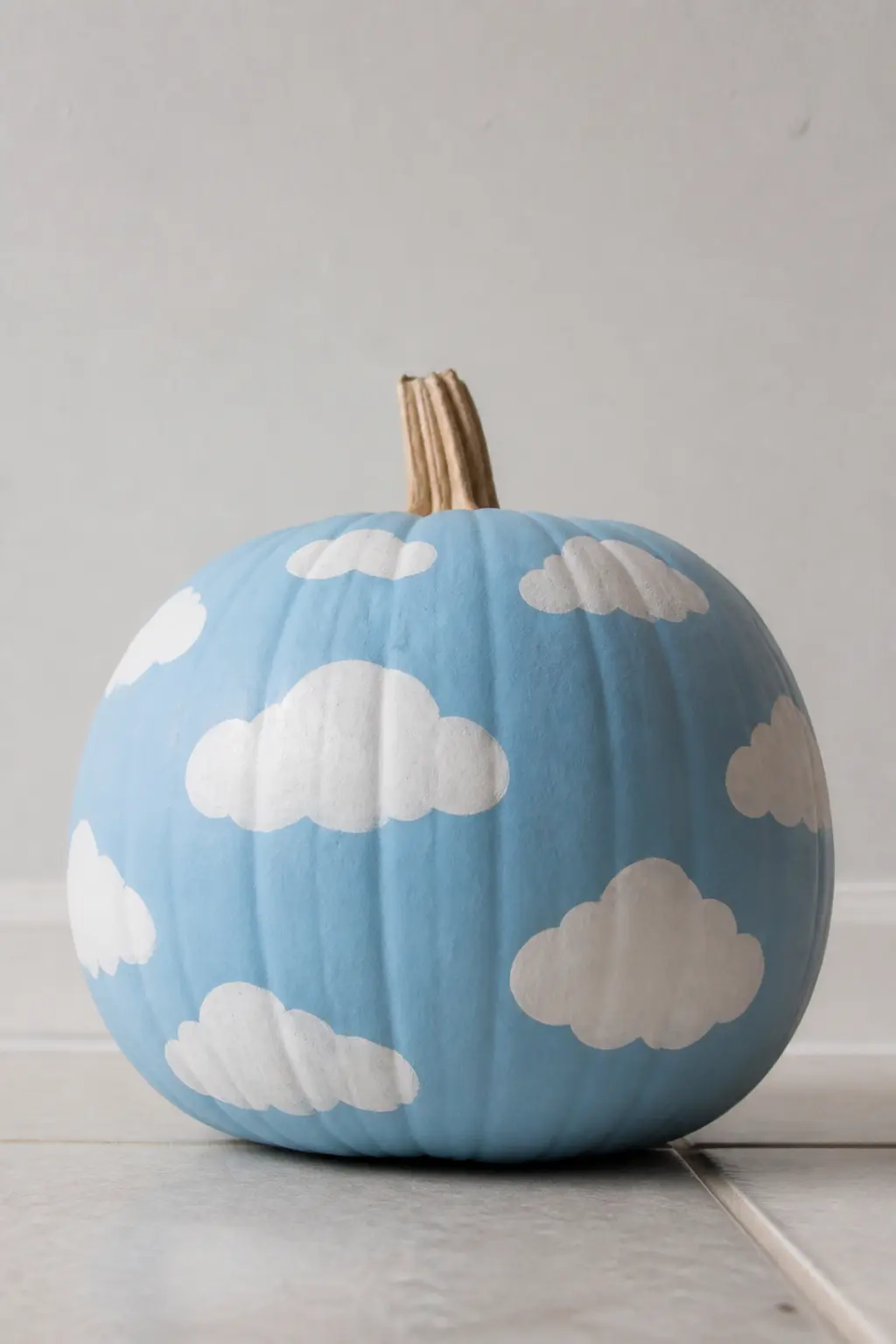 Powder Blue Pumpkin With White Clouds — Paint the pumpkin in matte powder blue. Pastel painted pumpkin