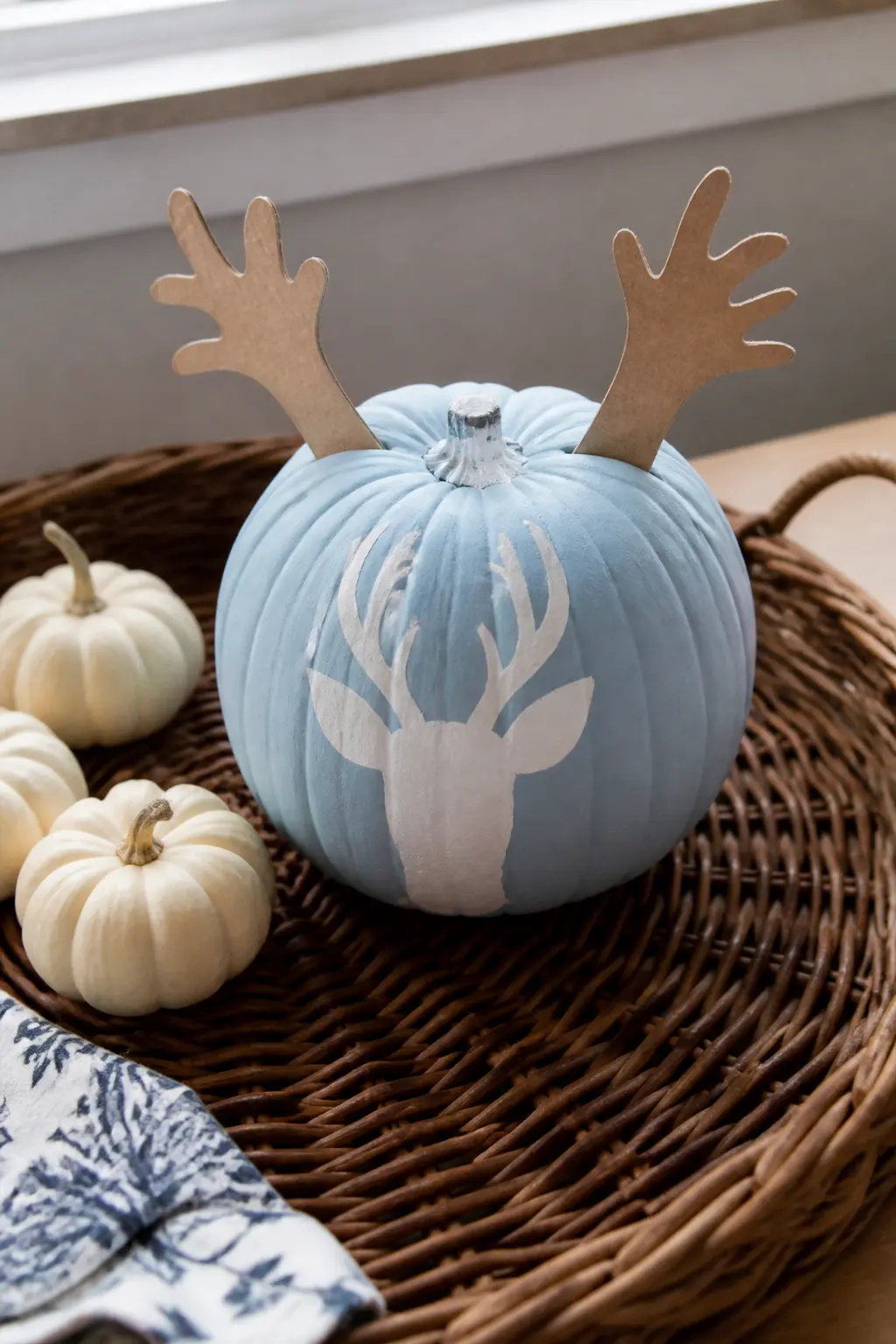 Powder Blue Pumpkin With a White Deer Face and Paper Antlers — Paint the base in matte powder blue. Pastel painted pumpkin