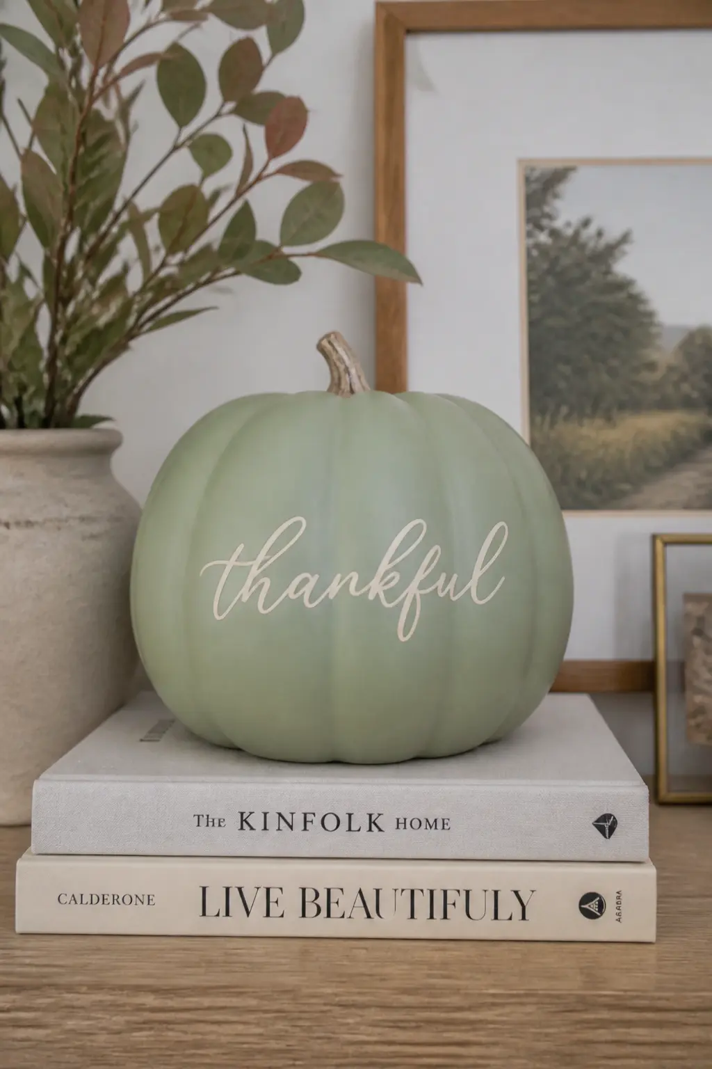 Sage Pumpkin With a Hand-Lettered Word — Paint the base in flat matte sage. Pastel painted pumpkin