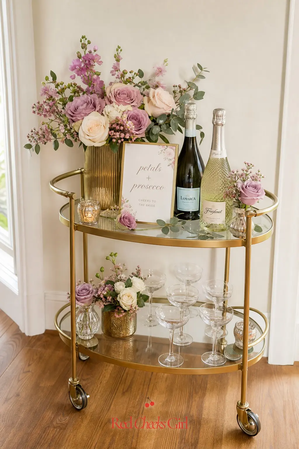 Floral Bar Cart — A brass-trimmed bar cart, dressed with a single trailing arrangement on top and glassware below, does the job of a full bar station in a