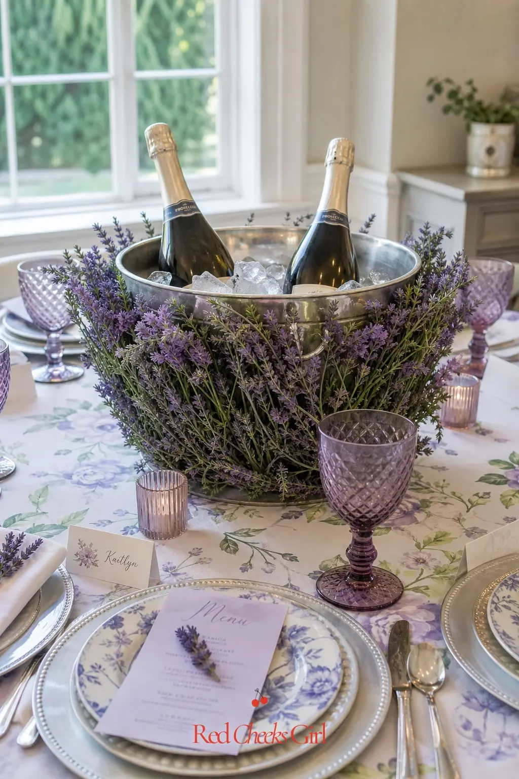 Floral Ice Bucket Centerpiece — An oversized ice bucket, wrapped in a cuff of lavender blooms and holding two or three chilling bottles, works as both