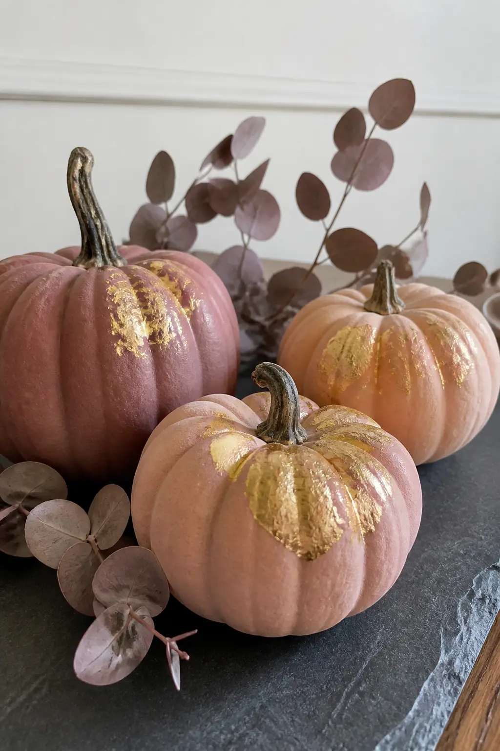 Gold-Leaf Blush Pumpkin Cluster — Paint three real gourds in blush, dusty mauve and warm peach. Pink halloween