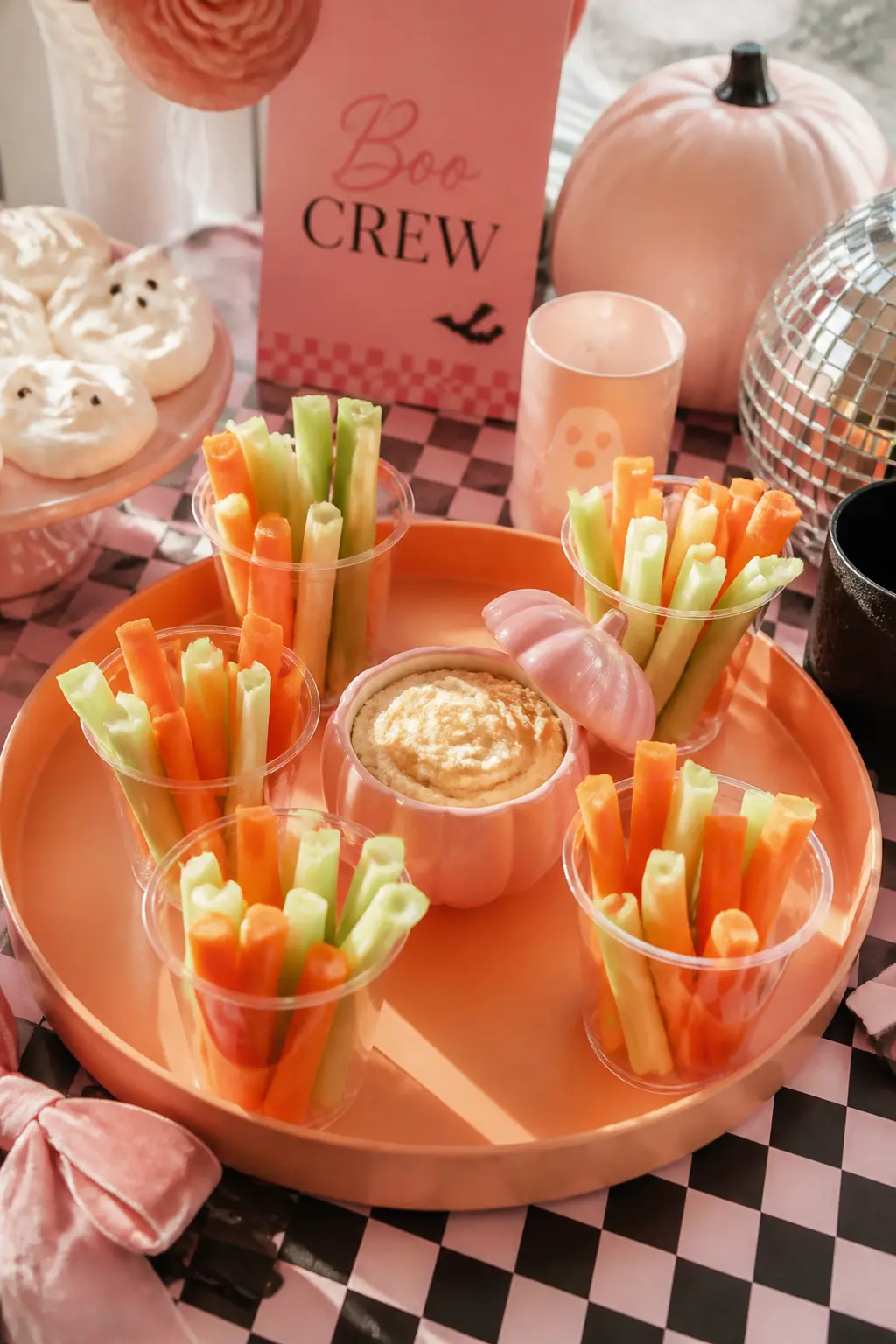 Veggie Cup Station with Pink-Lid Dip — Individual clear cups pre-filled with celery, carrots and cucumber spears remove the scrabbling-in-a-bowl problem and