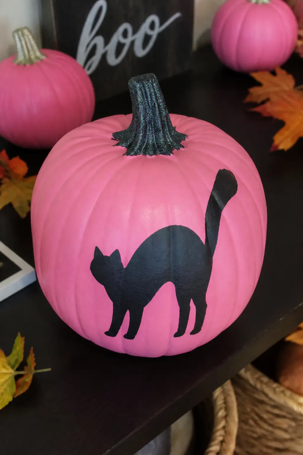 Mid Pink With a Black Cat Silhouette — Cut a simple cat silhouette from black adhesive vinyl or cardstock, including the arched back, raised tail and pointed