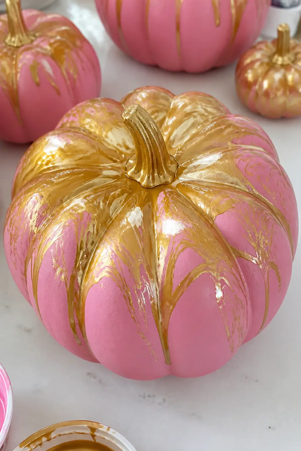 Mid Pink With Gold Marbling — Pour-and-swirl marbling gives mid pink a luxurious, gilded result that looks technically ambitious but is actually mostly