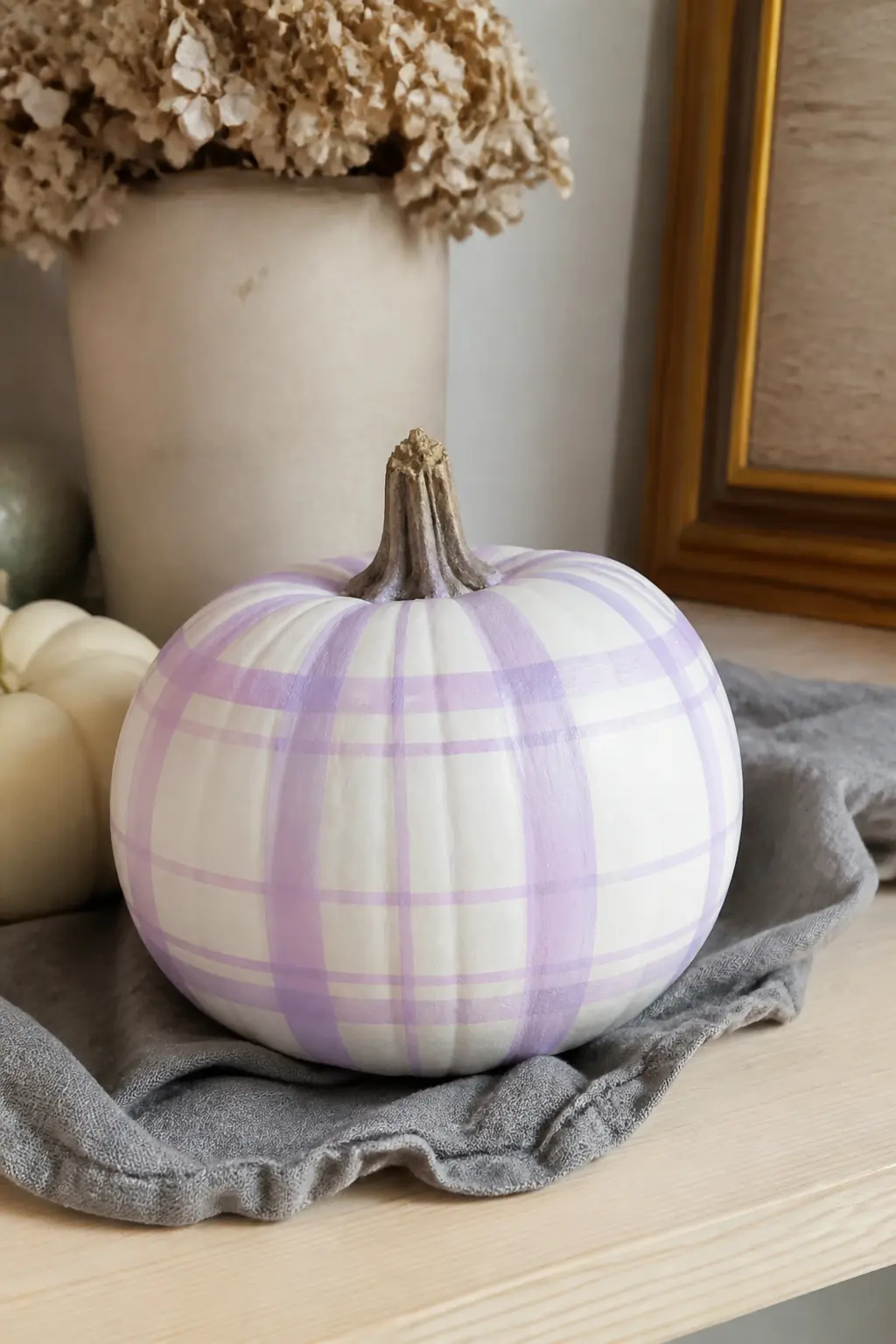 Lilac and White Plaid on a White Pumpkin for a Softer Look — Lilac plaid on a white pumpkin is the one entry here that steps furthest from the traditional