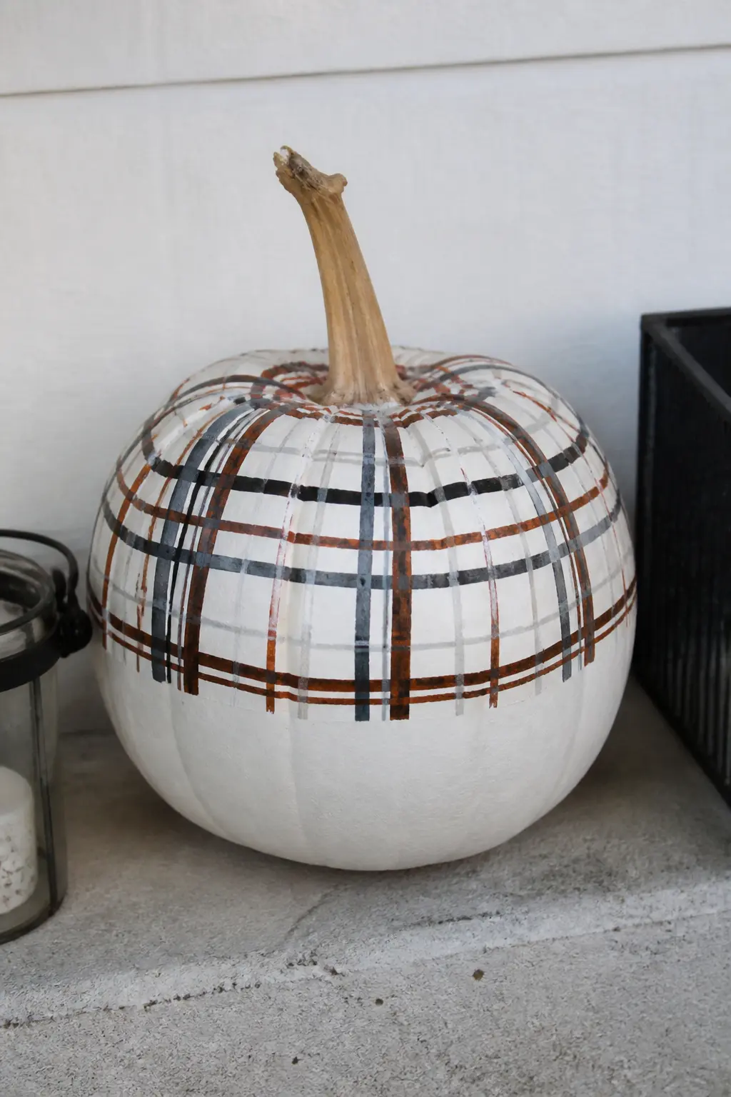 Plaid on the Top Half Only, Plain Below, on a White Pumpkin — This is the most unexpected design in the list. Plaid painted pumpkin