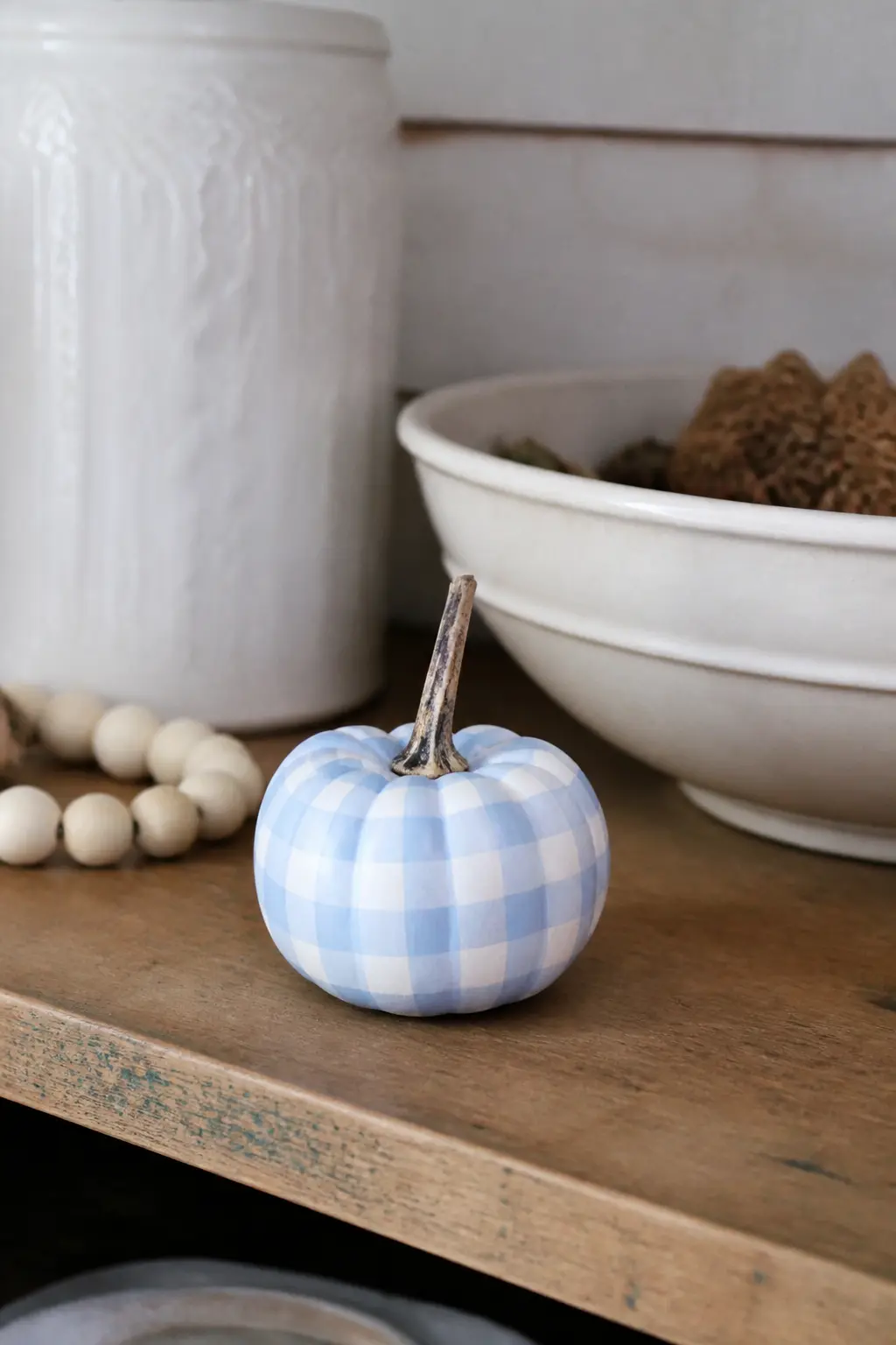 Soft Blue and White Gingham on a Painted Mini Pumpkin — A soft powder blue gingham on a white mini pumpkin is charming enough to live on a kitchen counter all