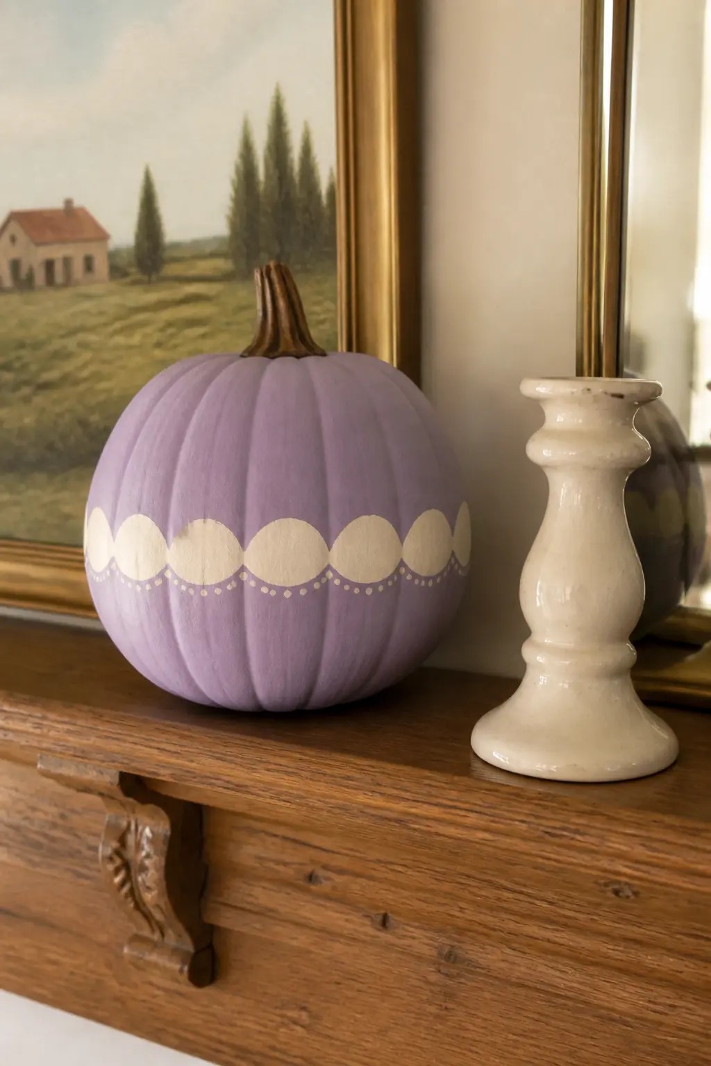 Lavender With a Cream Scalloped Band — A horizontal band of cream scallops painted around the widest part of the pumpkin reads like something between pottery