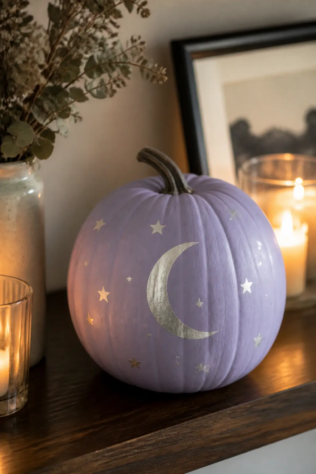 Lavender With Silver Moon and Stars — A crescent moon and a scatter of five-pointed stars in silver paint give this pumpkin a celestial quality that feels more