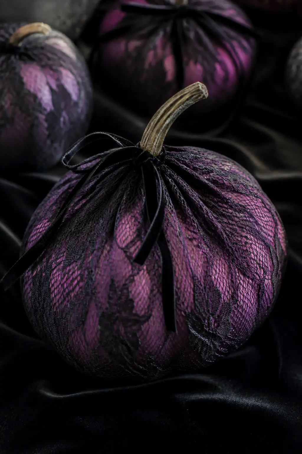Plum With a Black Lace Overlay — Wrap a plum pumpkin in a rectangle of black lace fabric, gathering it at the stem and securing with a thin black velvet ribbon