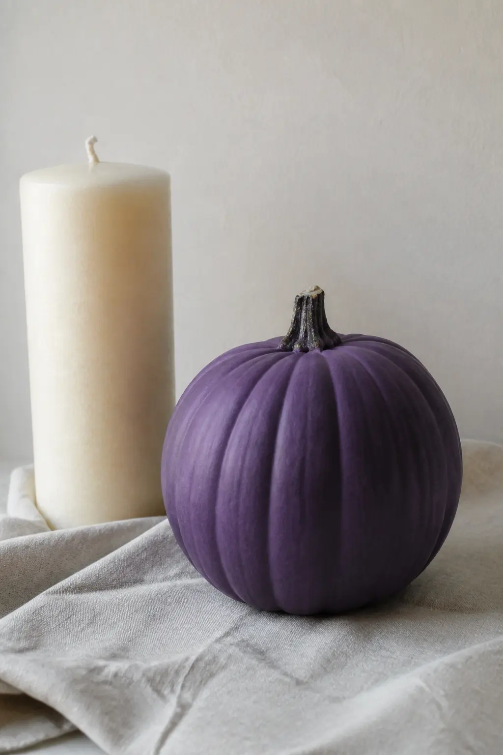 Purple With Cream and Nothing Else — Cream is the most versatile companion in this article and the most restrained. Purple painted pumpkin