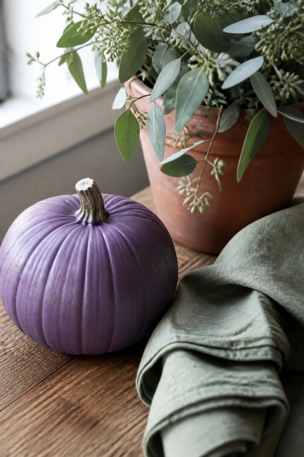 Purple With Sage Green — Sage green is muted enough to companion any shade of purple without fighting it. Purple painted pumpkin