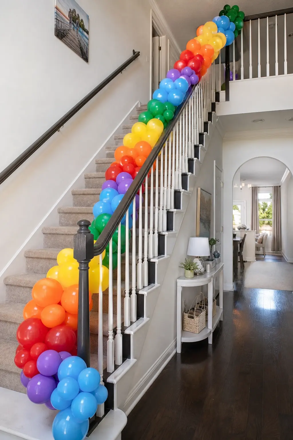 Spectrum Repeated Twice Along a Stair Banister — The full six-colour run completed twice within the length of the garland, so red through violet appears, then