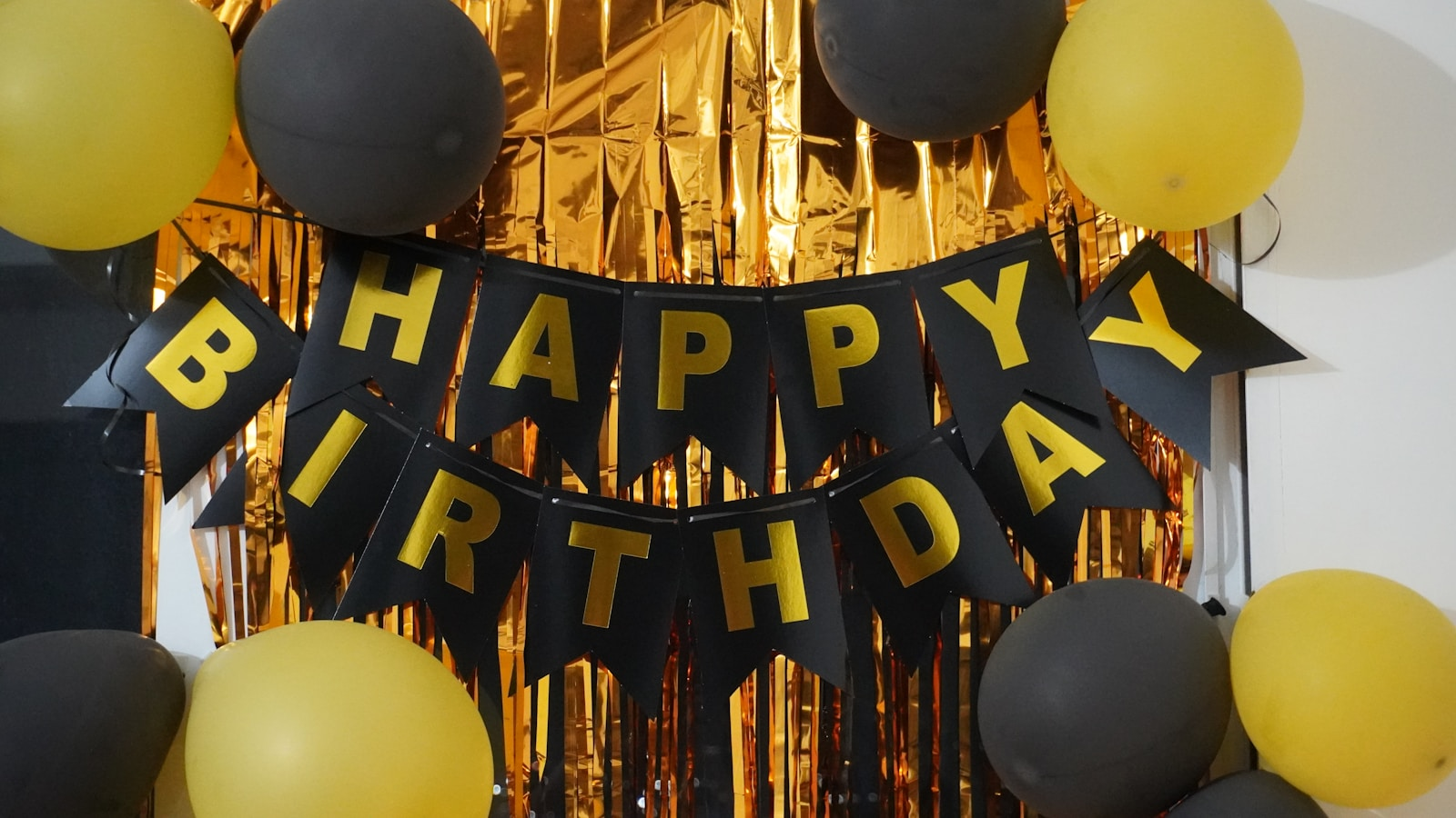 Birthday decorations with balloons and banner