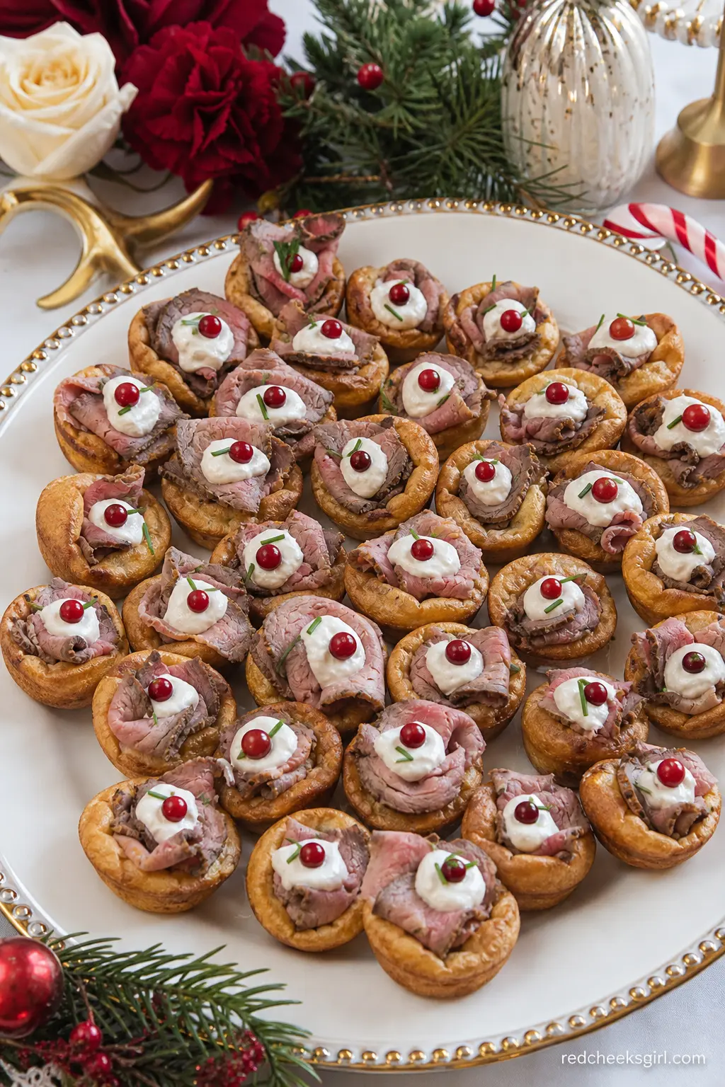Mini Yorkshire Puddings with Roast Beef and Horseradish — A platter of mini Yorkshire puddings filled with sliced roast beef and a dab of horseradish cream
