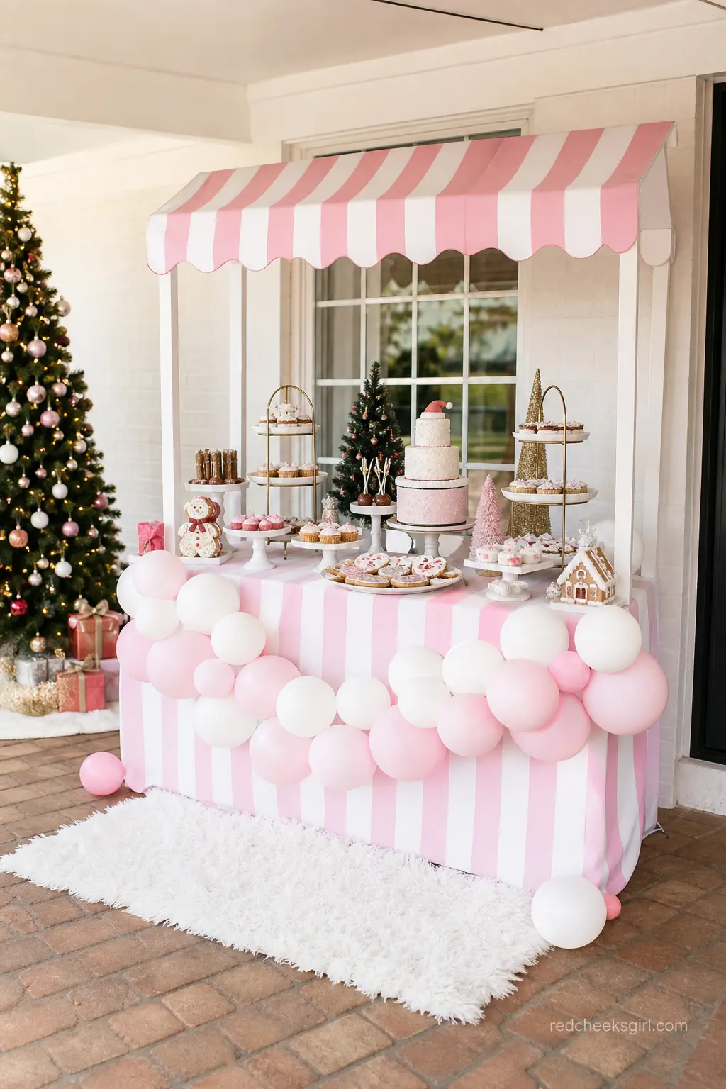 Pink and White Striped Dessert Table under a Mini Awning — A dessert table sits under a pink and white striped mini awning, with cake stands and a trailing