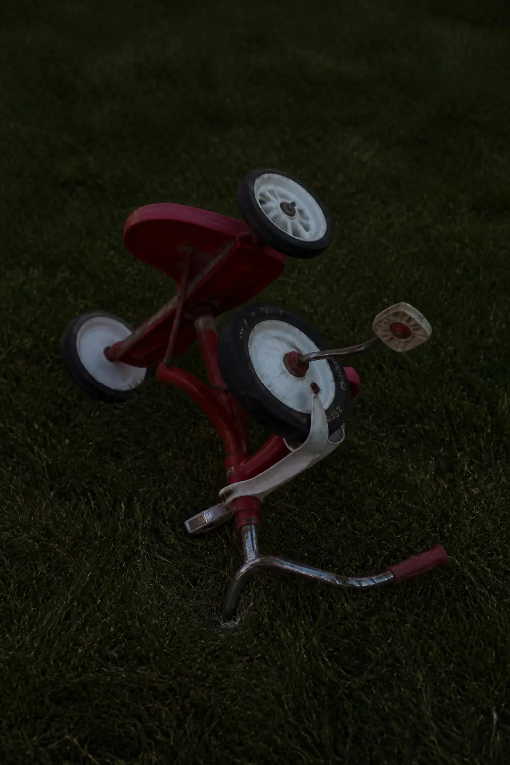Overturned Tricycle on the Lawn with Nothing Near It