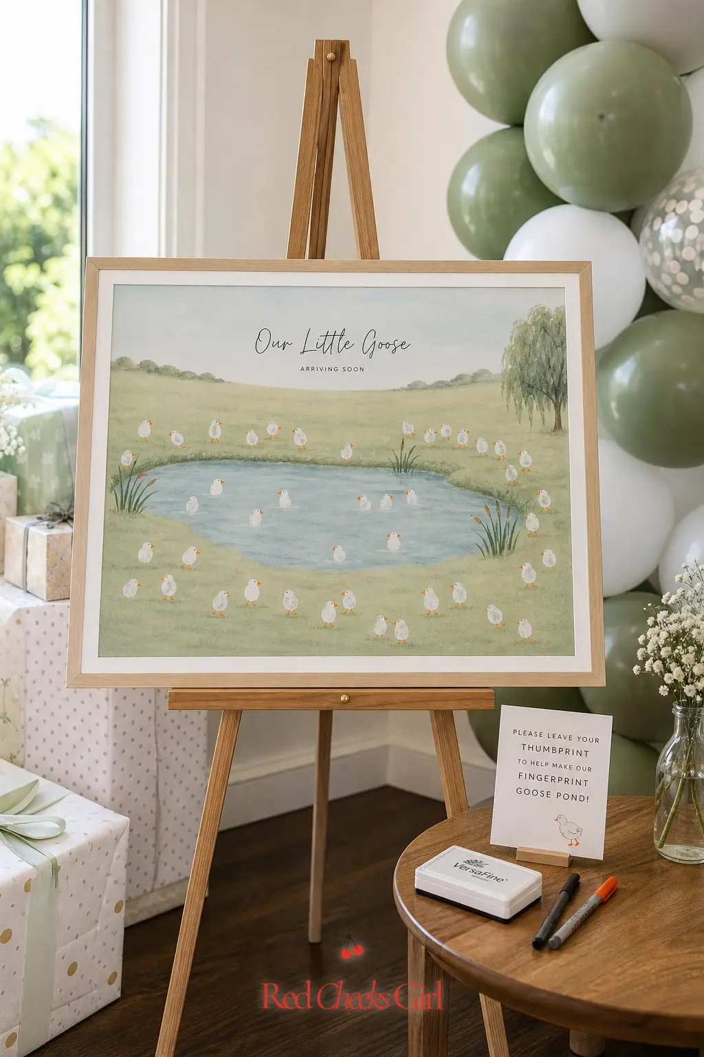 Fingerprint Goose Family Tree — A printed tree in sage green ink, framed and set on an easel, invites guests to press a thumbprint and turn it into a tiny