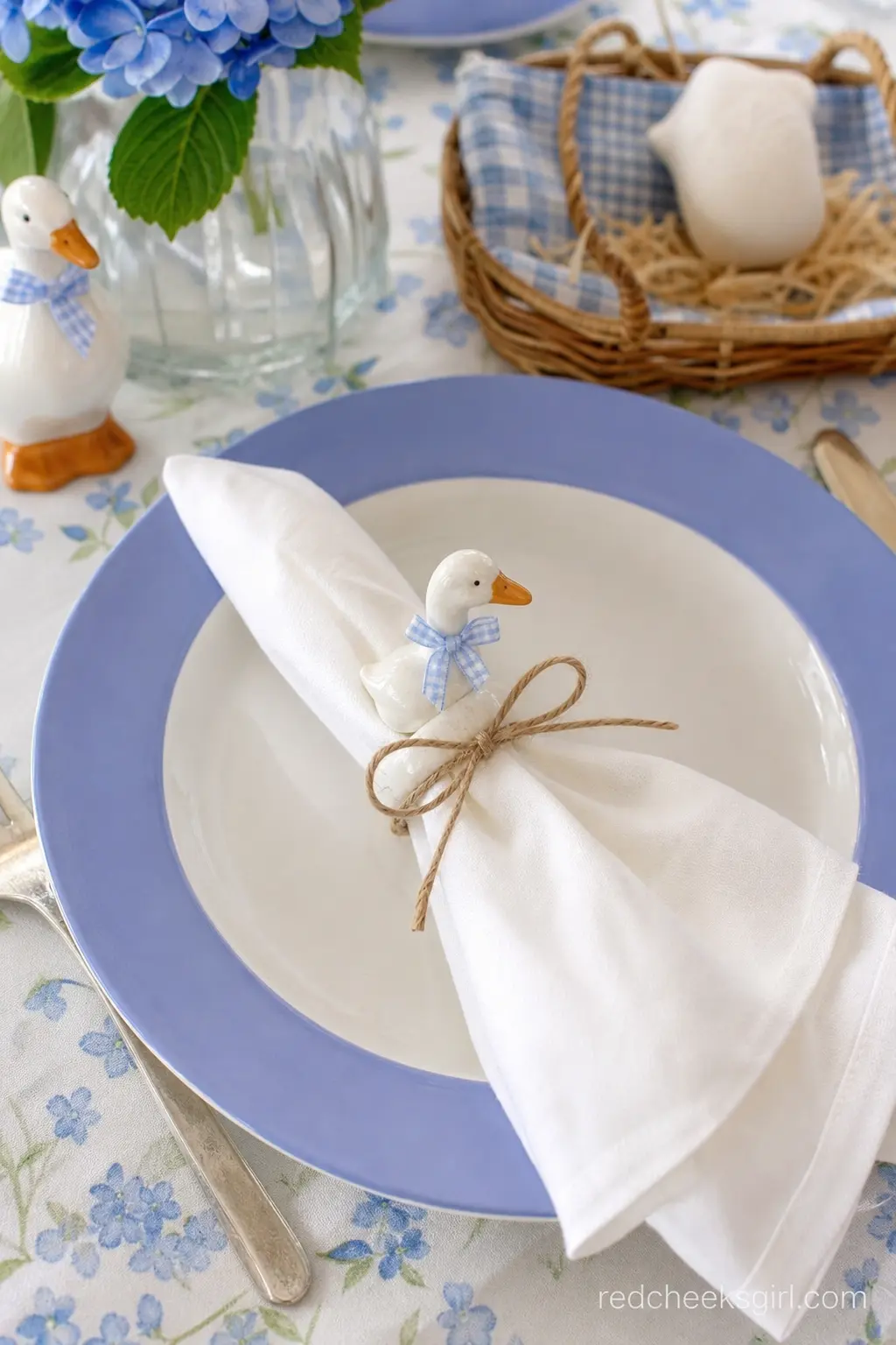 Periwinkle Place Setting — For a seated, slightly dressier shower, a single place setting does the storytelling: a periwinkle blue rimmed plate, a linen napkin