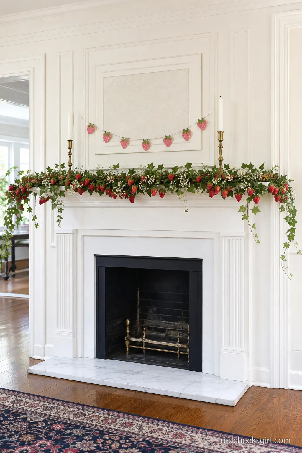 Fresh Strawberry Garland on the Mantel — A garland of fresh strawberries threaded with ivy and small white flowers dresses a fireplace mantel without a single