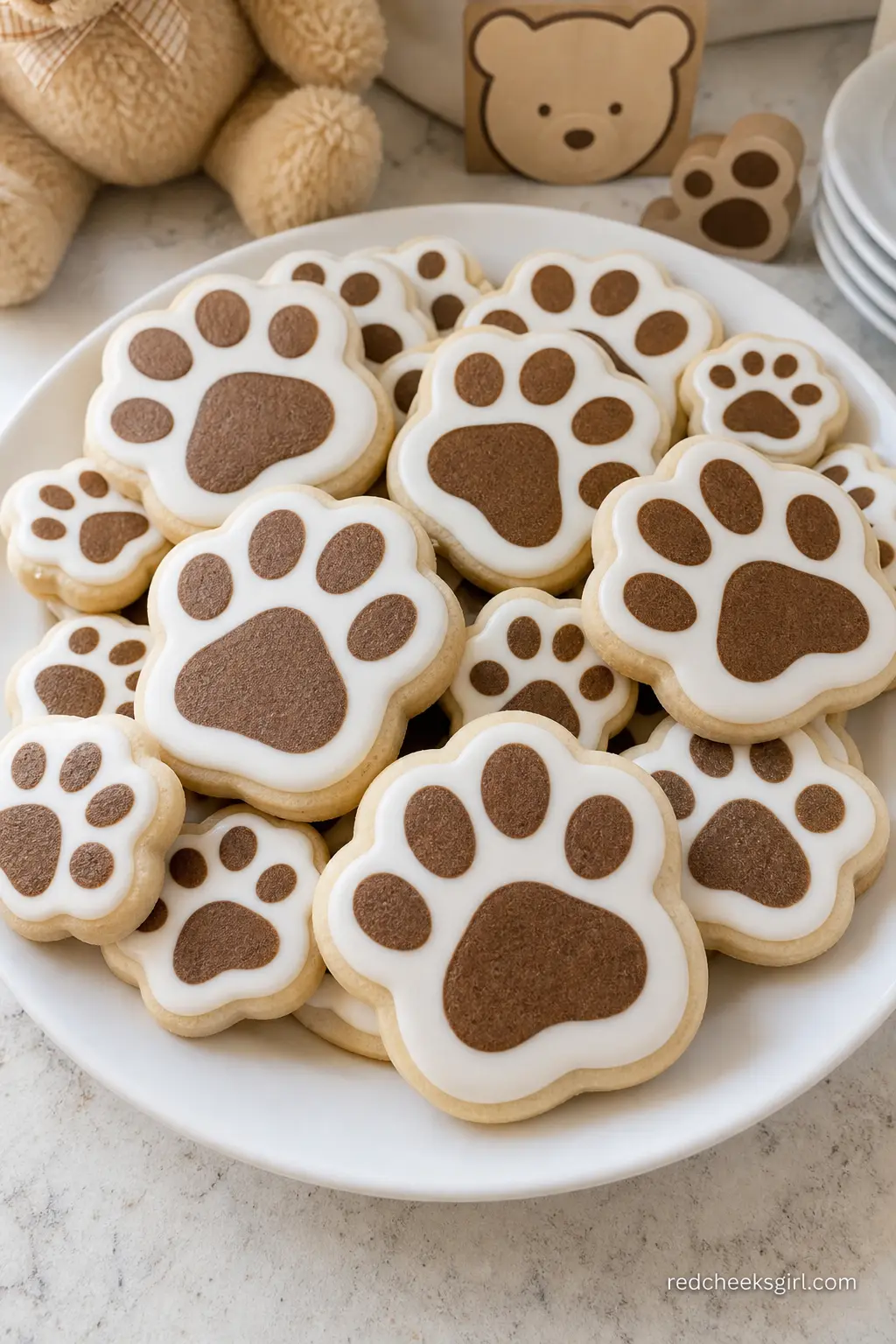 Bear Paw Cookie Platter — White royal icing cookies stamped with a simple brown paw print are easy enough to order from a home baker or to pipe yourself with a