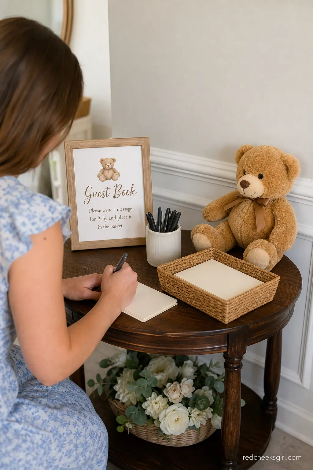 Guest Book Teddy Bear Station — A small table holding a basket of blank cards, a cup of pens and one seated cream bear turns the usual guest book into