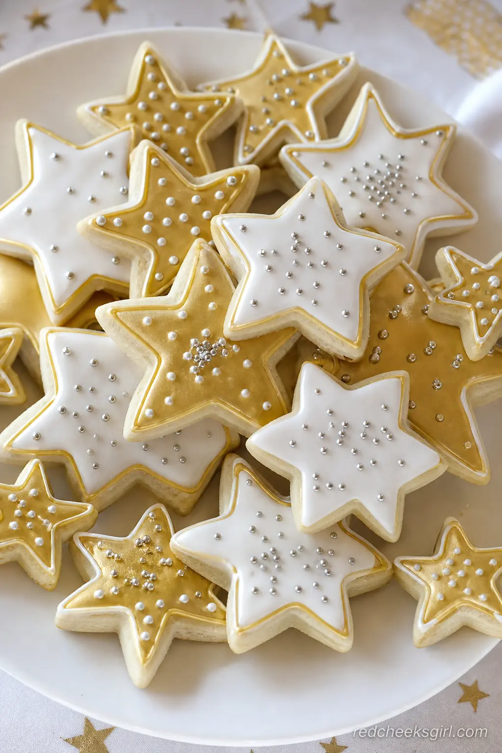 Gold Star Sugar Cookies — Star shaped sugar cookies iced in glossy gold and white with a dusting of silver sanding sugar work as dessert or favors. Twinkle